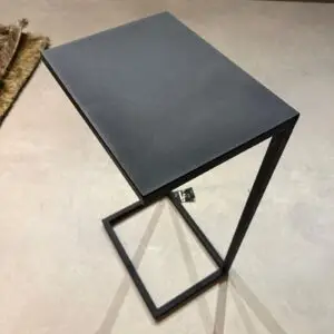 Black matte metal side table with a square top and open square-frame legs, viewing from above-left angle.